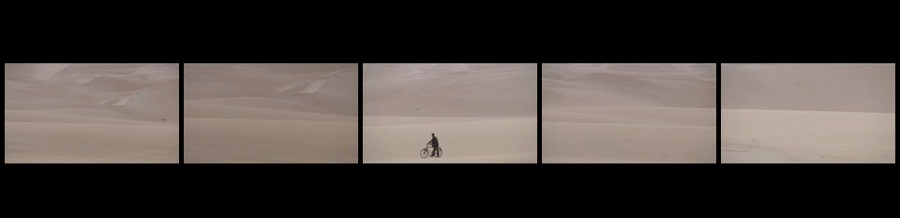 Identity of the Soul 5 screen film man with bicycle in desert