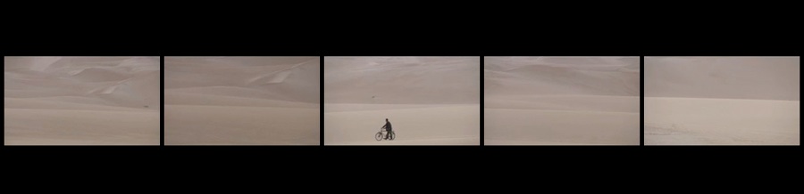 Identity of the Soul 5 screen film man with bicycle in desert